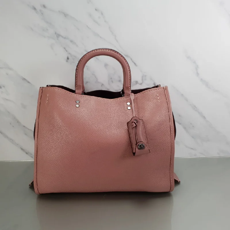 Water-resistant travel backpacksCoach 1941 Rogue 31 in Dusty Rose Pink Mixed Leather with Burgundy Suede - Pebbled Leather Handbag