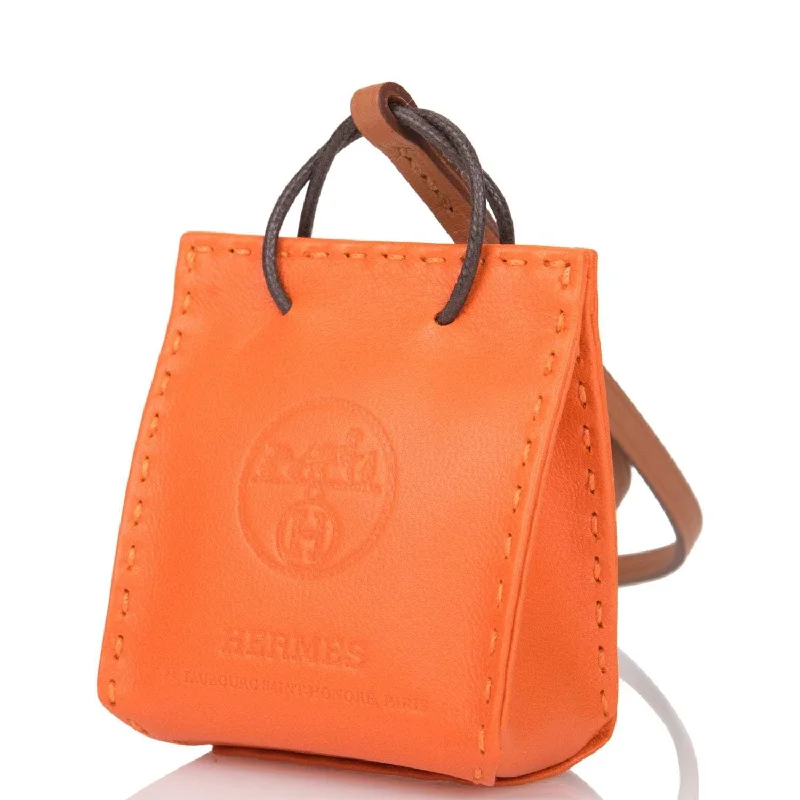 Customizable monogram bagsHermes Orange Mini Shopping Bag Charm