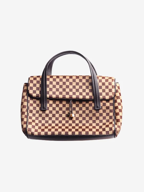 Best bags for weekend getawaysBrown 2002 Damier Sauvage Lion bag