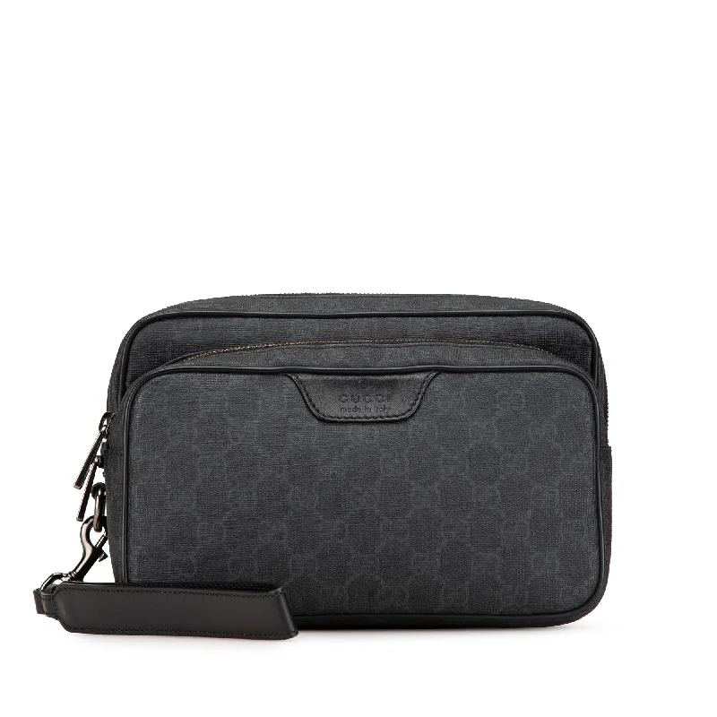 Best bags for business tripsBlack Gucci GG Supreme Clutch